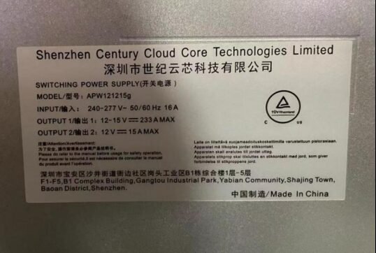 APW121215g power supply label showing 240-277 V input and 12-15 V output