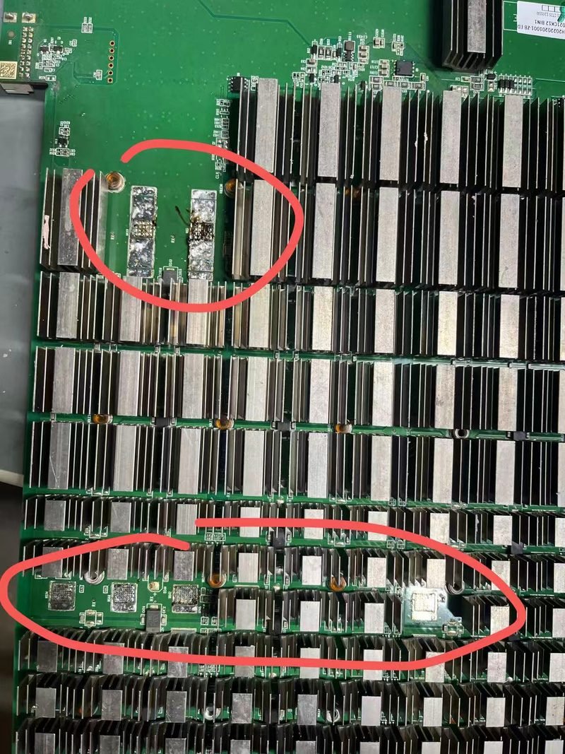 Hashboard with damaged ASIC chips marked for replacement