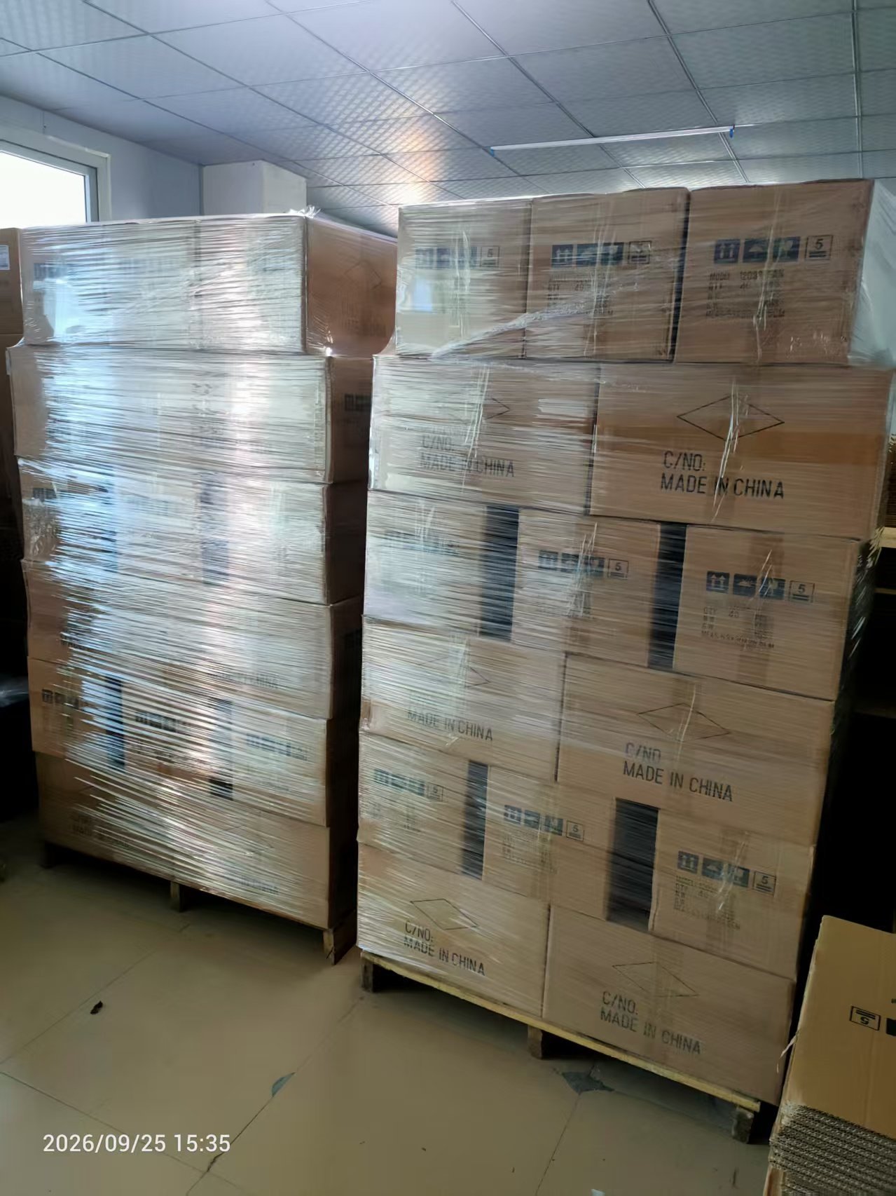 Cartons of mining fans shrink-wrapped on pallets for shipment